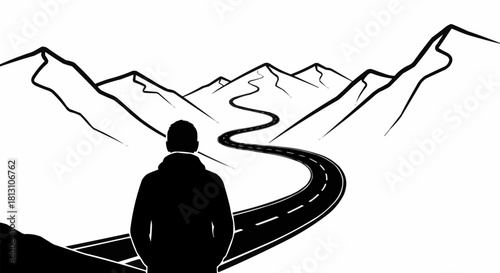 Silhouette of a person standing on a winding road leading into mountains.
