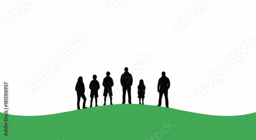 Silhouettes of a Family Standing on a Green Hill Under a White Sky.