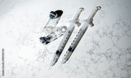 Close up of Single Use Syringes with Small Glass Vials