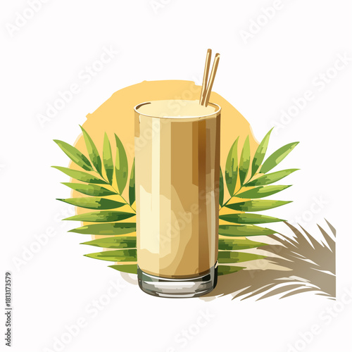 Tall glass of creamy yellow beverage with two thin straws and green palm leaves on a white background with a soft yellow circular shadow
