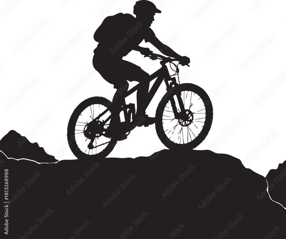 Fototapeta premium Black silhouette of a mountain biker on a rocky trail