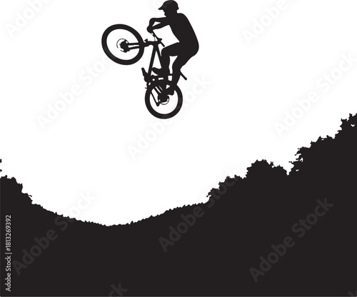 Black silhouette of a mountain biker performing a jump