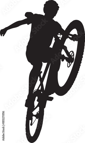 Black silhouette of a person riding a bicycle doing a wheelie