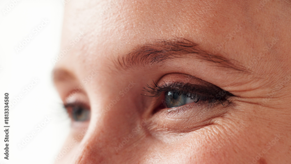 Fototapeta premium Woman, closeup and vision with eyes in studio for eyesight, visual perspective and insight. Female person, retinal focus and lens coordination for perception, clear sight and peripheral awareness