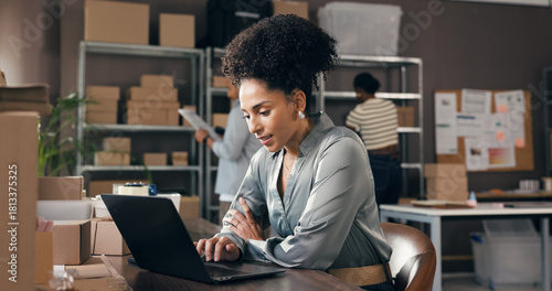 Photos Logistics, woman or scroll on laptop in small business to track delivery, process order or shipping