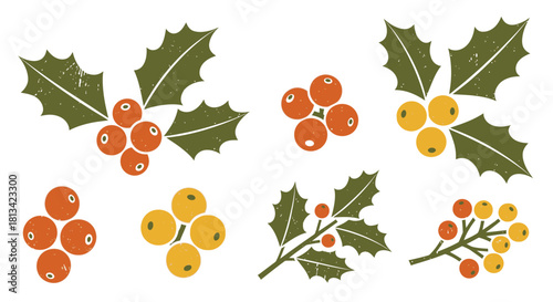 Isolated autumn leaves, red berries, and holly branches form a festive nature set for holiday decoration