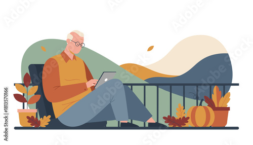 Elderly man using tablet on an autumn balcony Retirement technology and comfortable modern life