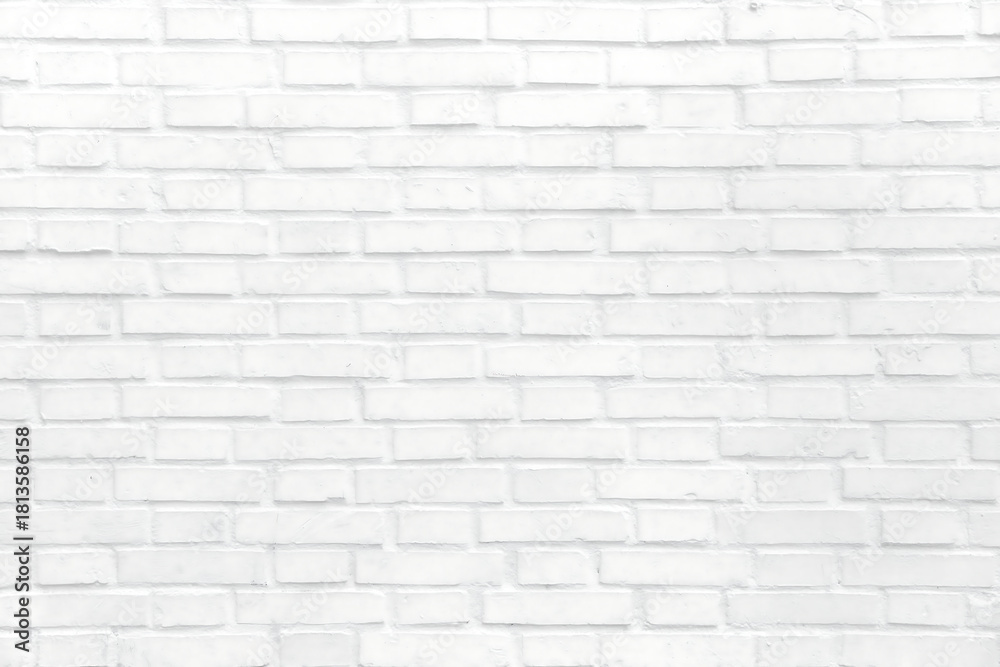 Naklejka premium Clean white brick wall texture offers a modern, minimalist backdrop for versatile design projects and creative presentations, providing a bright neutral surface