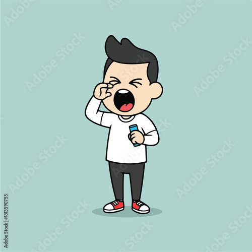 Tired young boy yawning and rubbing his eye holding a smartphone feeling sleepy and exhausted.