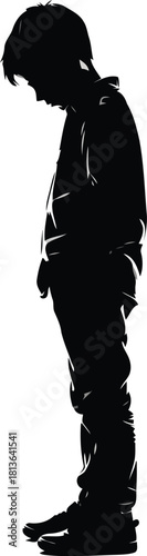 Silhouette of a sad boy bowing head
