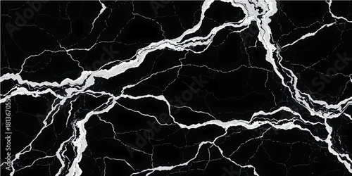 A bright blue lightning bolt flashes with electric power across the dark night sky during a thunderstorm