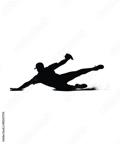 Dynamic baseball player silhouette captured mid dive to catch ball in action silhouette