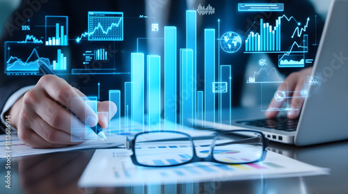 Financial analyst reviewing data analytics with digital graphs in a modern office, forecasting future growth and making data driven decisions for success