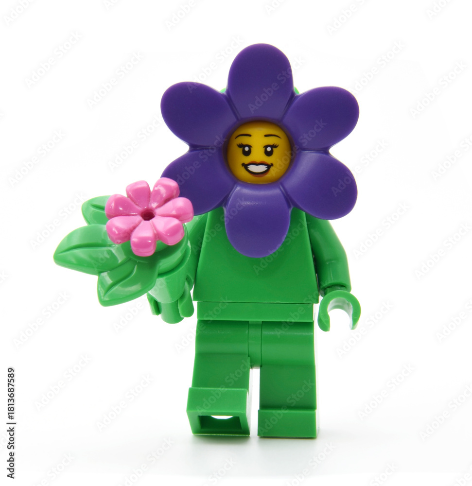 Naklejka premium Editorial illustrative image of lego minifigure of violet flower isolated on white.