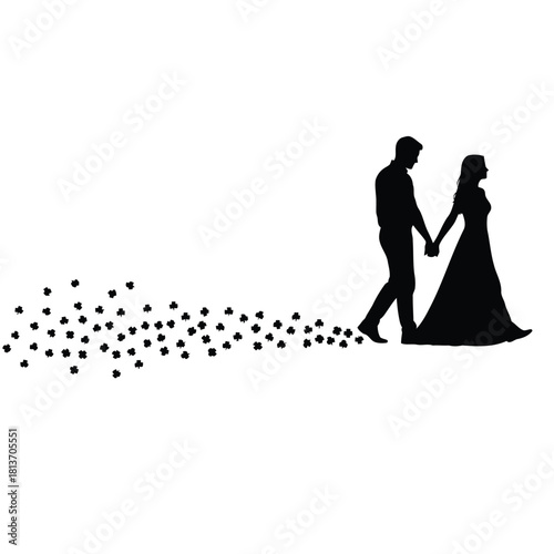 Silhouette of bride and groom walking holding hand
