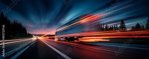 Truck with motion blur on the highway during dusk, side view with abstract light trails. Concept for logistics management, fast delivery and distribution services © Rifqi