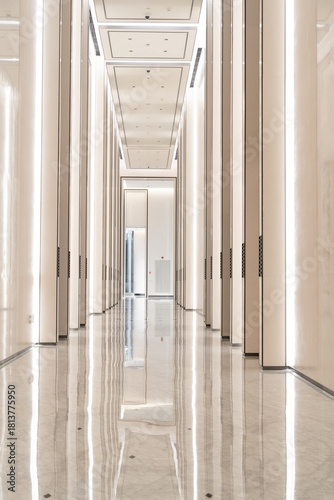 sleek elevator lobby with polished marble and modern lighting