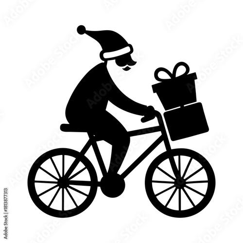 Silhouette of santa claus riding a bicycle with christmas gifts in the basket
