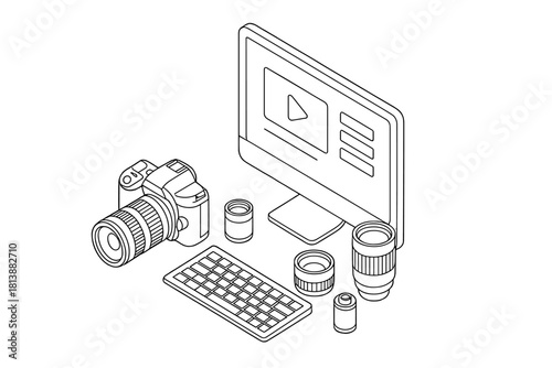 Professional digital media creation setup with camera, lenses, computer monitor, and keyboard