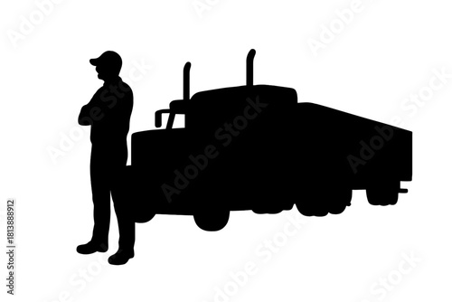 Silhouette of a truck driver standing next to a large semi-trailer truck