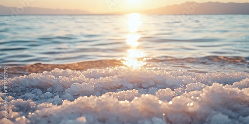 Salt crystals forming on the shore of the dead sea at sunset in israel