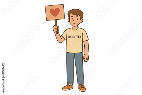 Smiling young volunteer holding up a placard displaying a red heart symbol