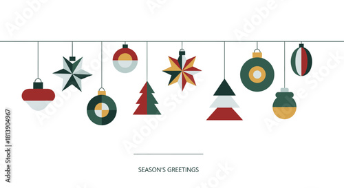 Conceptual holiday banner with a collection of hanging geometric Christmas tree ornaments and modern decorations