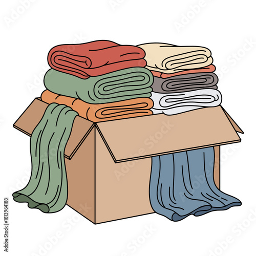 Folded blankets in a cardboard box for donation