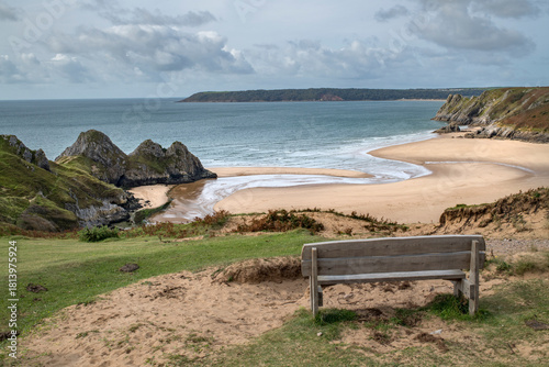 Hikers resting bench at Three Cliffs Bay Wales