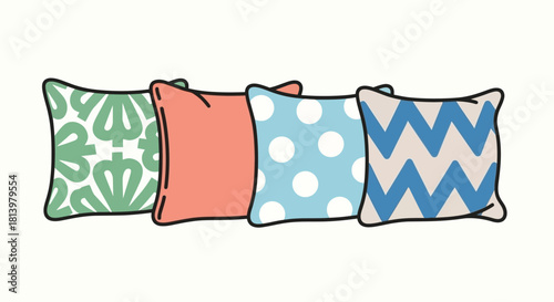 Four decorative throw pillows with different patterns and colors arranged in a row.