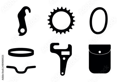 Dark silhouette of bicycle components on textured background