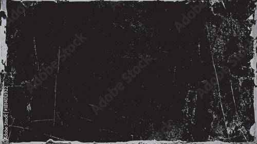 Dark textured background with distressed grunge effect and light scratches and speckles black