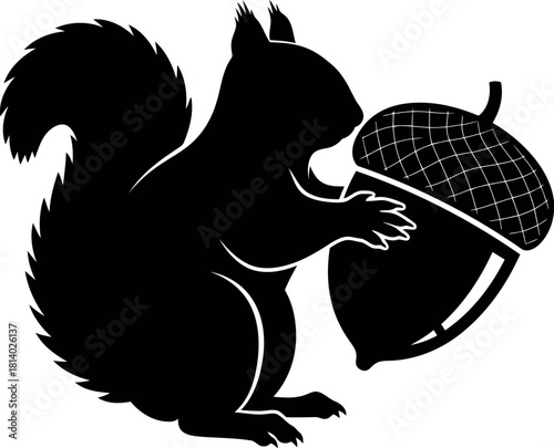 Black squirrel silhouette with large acorn