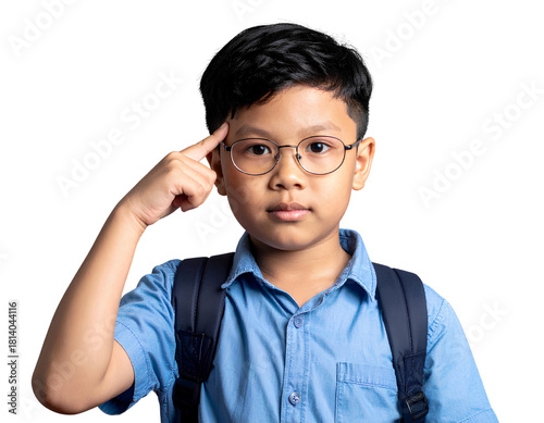 Smart Asian boy pointing to his temple in a thinking gesture. Concept for education