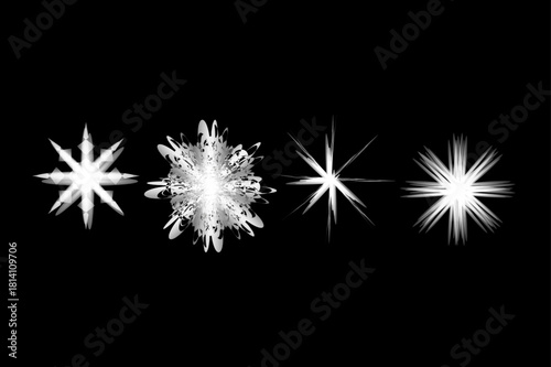 Four bright white starbursts and sparkles on a dark black background.