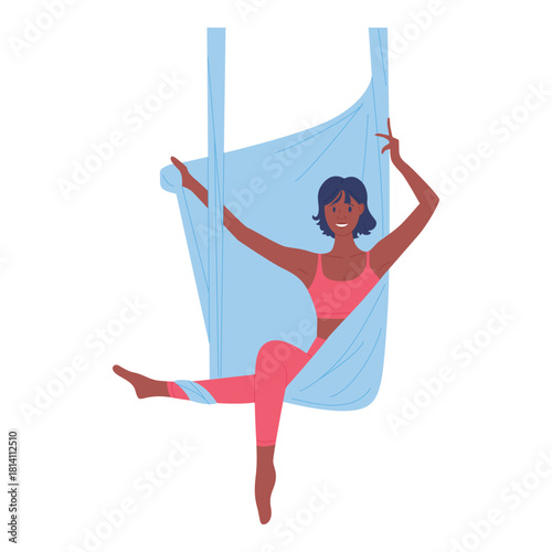 A person practicing aerial yoga, showcasing flexibility and joy while gracefully suspended in midair