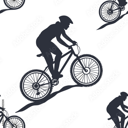 Silhouette of a mountain biker riding a bicycle in motion