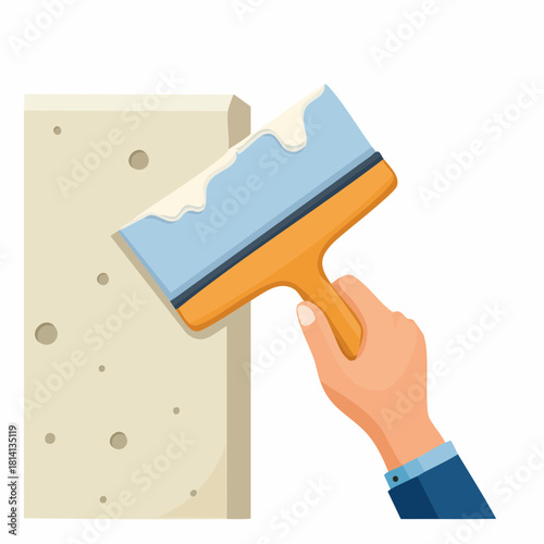 Ambiance bricolage, gros plan sur une main qui étale de l'enduit sur un mur avec une spatule, ou taloche, rénovation, travaux