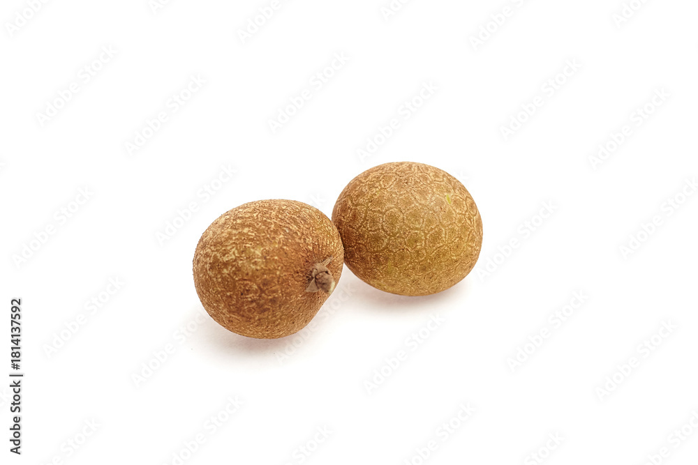 Fototapeta premium Longan tropical fruit, featuring two round, textured brown fruits with a smooth surface, showcasing natural beauty and freshness in a minimalist setting for culinary and health concepts