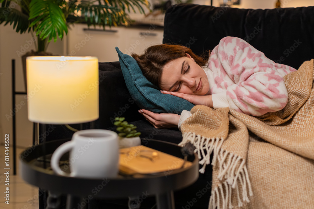 Φωτογραφία Middle-aged woman at night home lies on pillow after hard work day eyes close breathing slows drifts to sleep