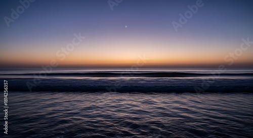 Fototapeta Naklejka Na Ścianę i Meble -  Ocean waves at twilight with a single star
