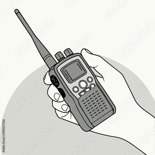 Hand holding a gray walkie-talkie with an extended antenna radio communication