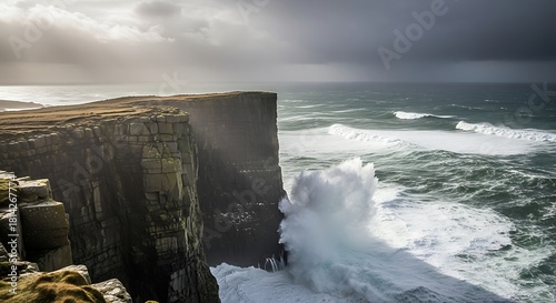 Fototapeta Naklejka Na Ścianę i Meble -  Dramatic sea wave crashing against cliff