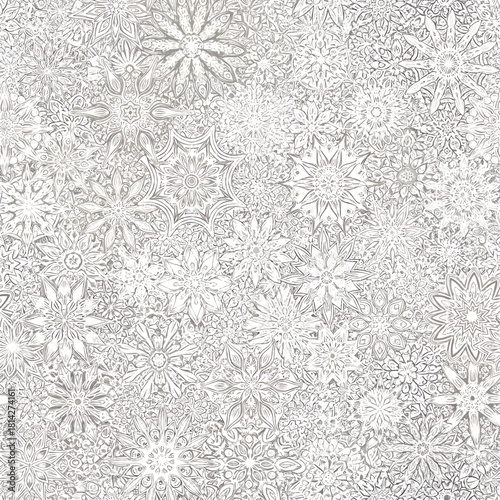 Intricate monochrome illustration of numerous detailed snowflakes, creating a textured, wintery pattern.