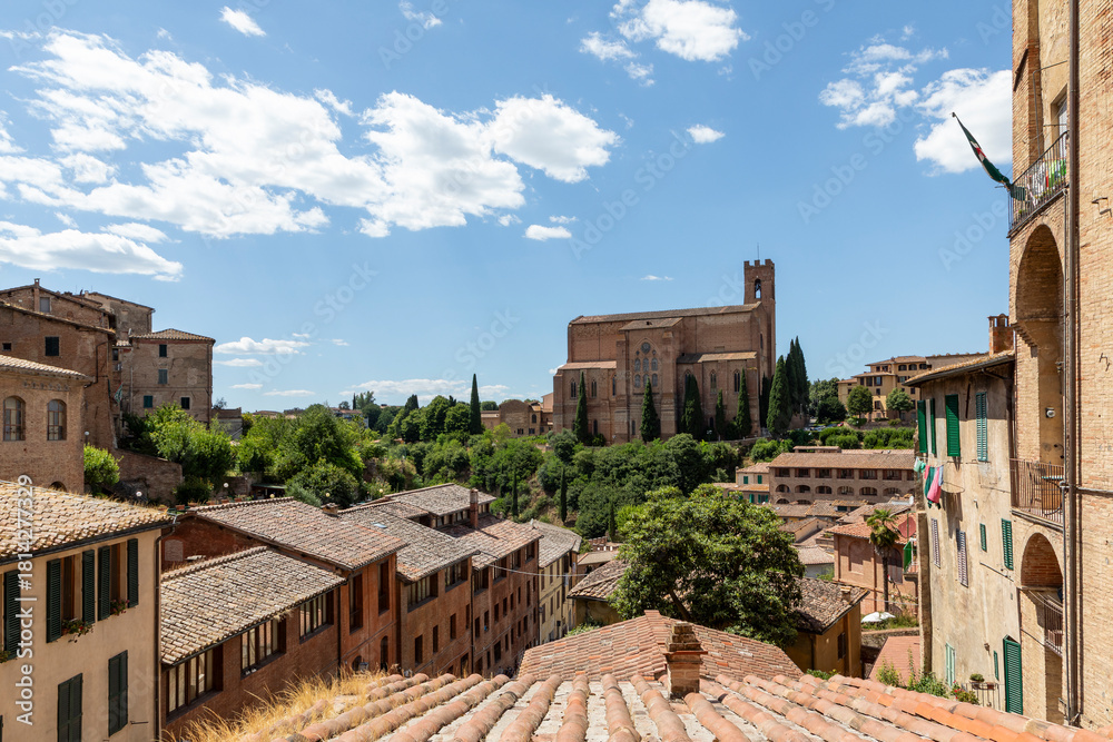Obraz premium basilica di san domenico in siena tuscany italy seen across rooftops on a sunny day no people