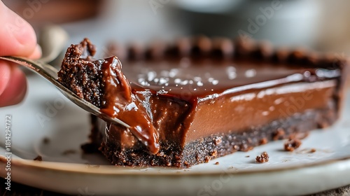 Rich Chocolate Cake Slice with Glossy Ganache and Crumb Topping in Close-up