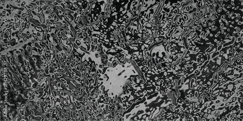 Abstract grayscale textured background with organic patterns and swirling shapes creating a complex and detailed visual surface