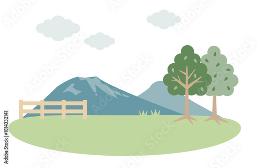 山々が見える牧草地の昼間の景色