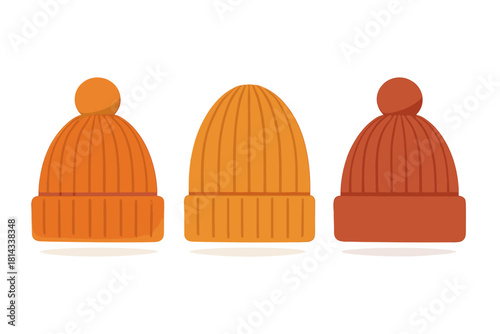 Three colorful knit winter hats and beanies in shades of orange and red for cold weather fashion