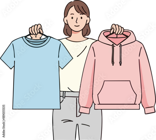 Woman Holding TShirt and Hoodie on Hangers for Selection.